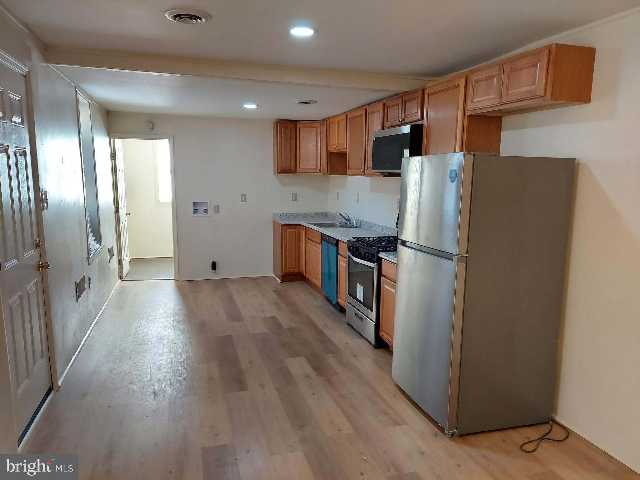 264 West Market Street, Unit 2 York, PA 17401 - Photo 9 of 12 a kitchen with stainless steel appliances granite countertop a refrigerator and a stove