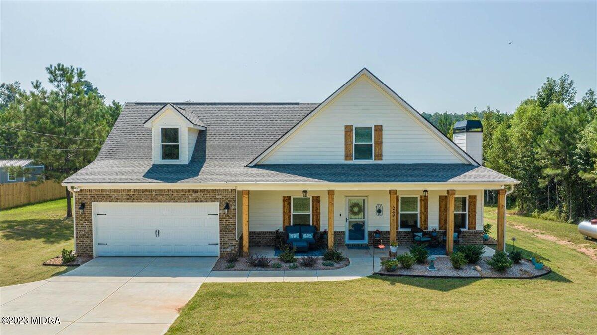 a front view of house with outdoor seating and swimming pool