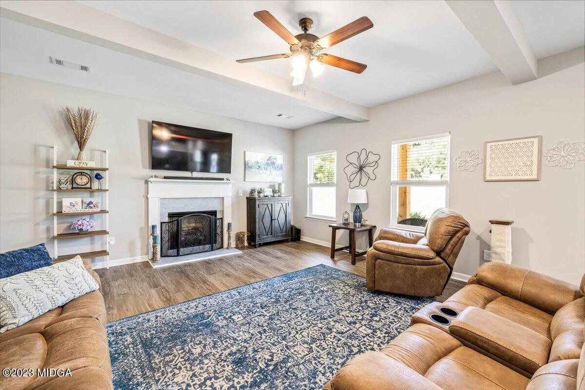 249 Davis Road Gray, GA 31032 - Photo 2 of 53 a living room with furniture a flat screen tv and a fireplace