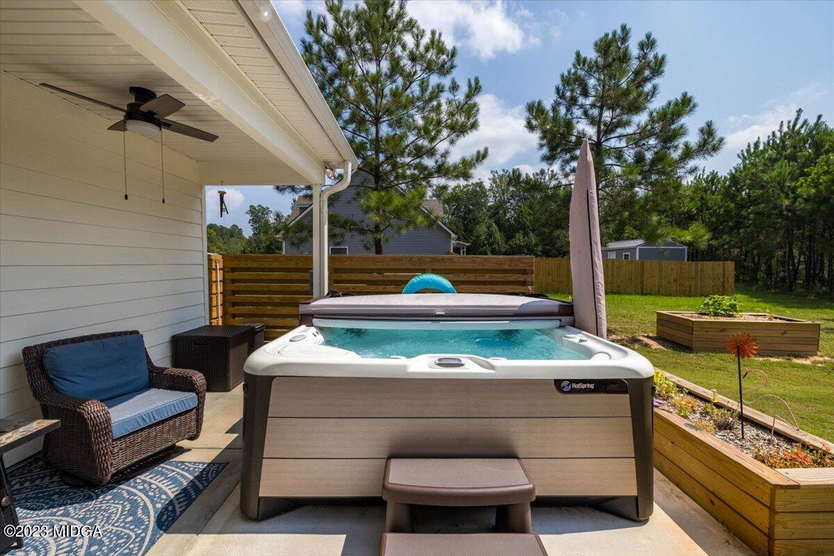 249 Davis Road Gray, GA 31032 - Photo 28 of 53 a outdoor sitting area with a couch and a barbeque