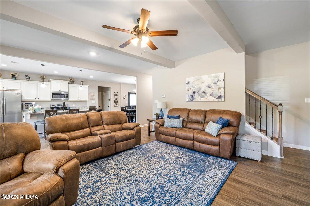 249 Davis Road Gray, GA 31032 - Photo 3 of 53 a living room with furniture kitchen view and a chandelier