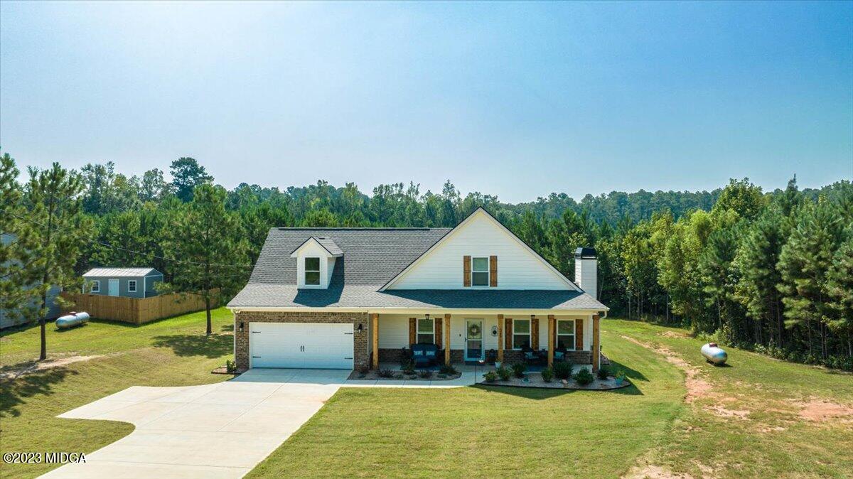 249 Davis Road Gray, GA 31032 - Photo 34 of 53 a front view of a house with garden
