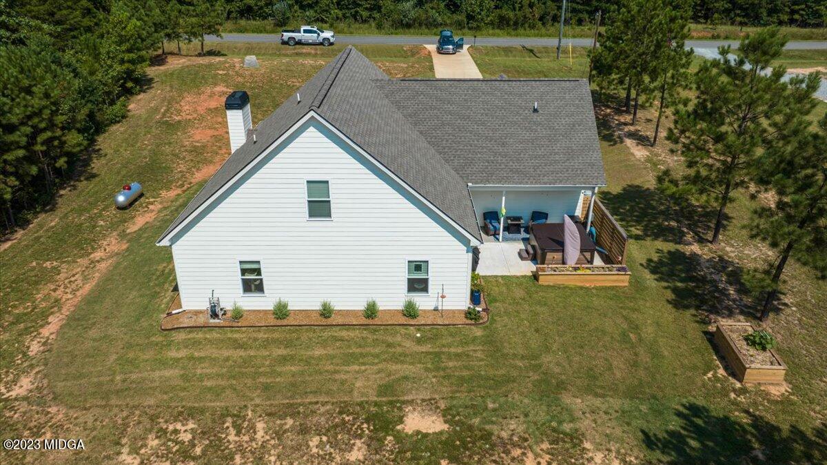 249 Davis Road Gray, GA 31032 - Photo 43 of 53 a view of house that has a small pool