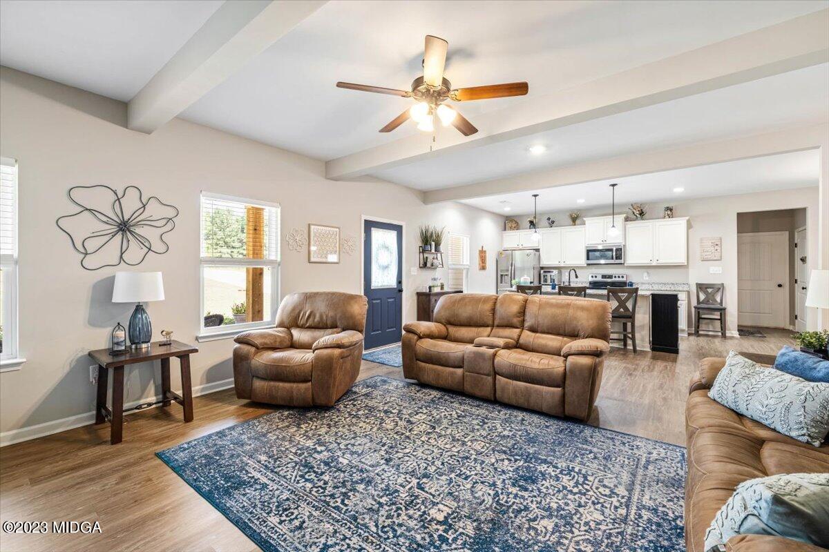 249 Davis Road Gray, GA 31032 - Photo 5 of 53 a living room with furniture ceiling fan and a rug