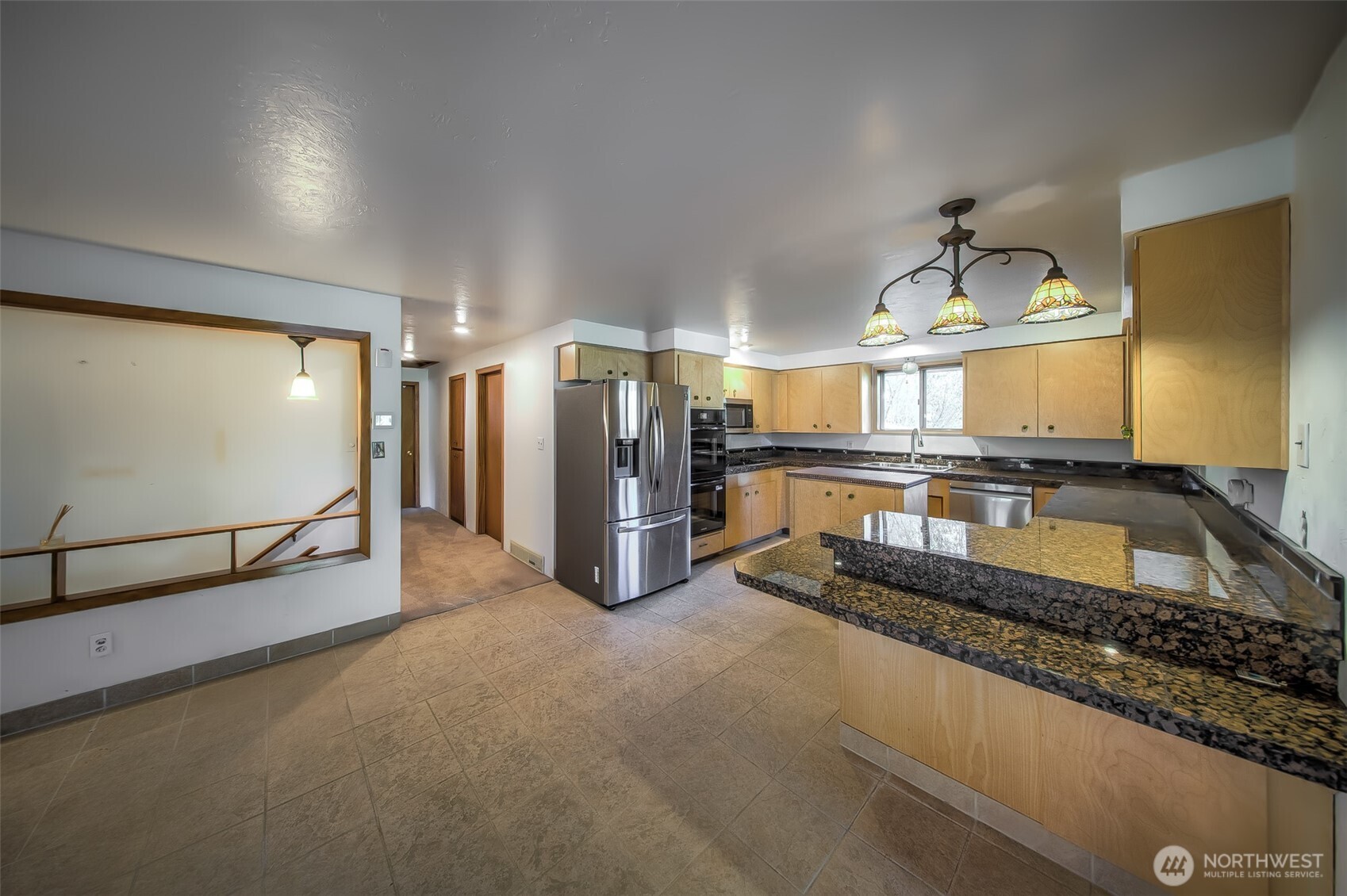 4110 Baker Ames Road Northeast Olympia, WA 98506 - Photo 21 of 40 a kitchen with refrigerator and mirror