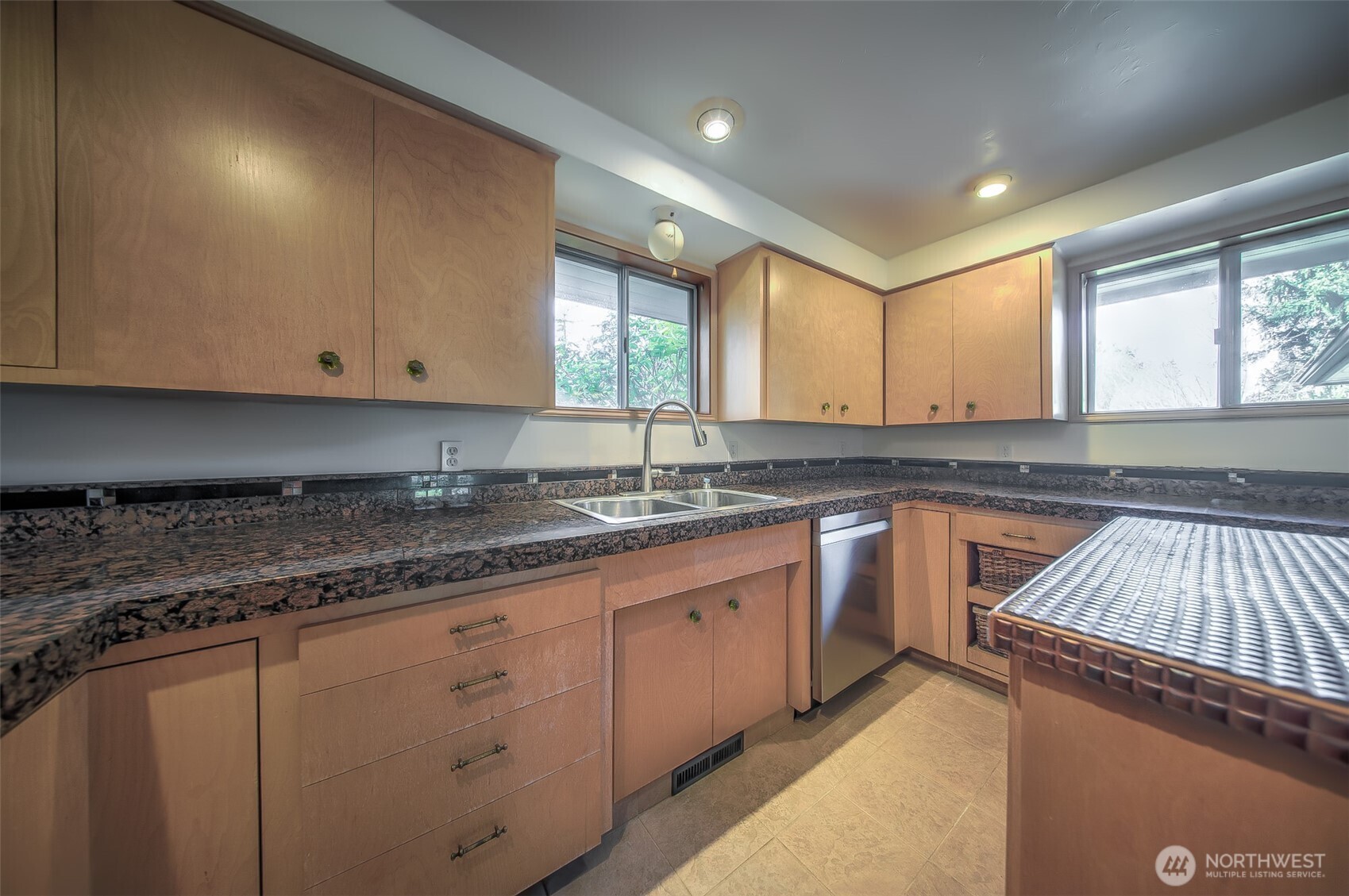 4110 Baker Ames Road Northeast Olympia, WA 98506 - Photo 22 of 40 a kitchen with granite countertop a sink cabinets and window