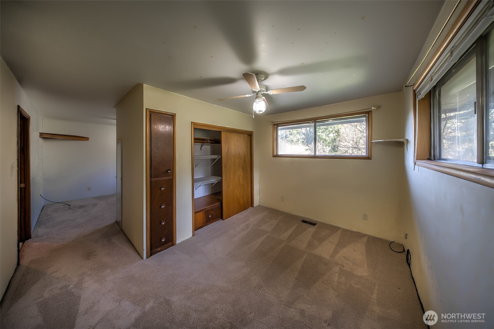 4110 Baker Ames Road Northeast Olympia, WA 98506 - Photo 25 of 40 an empty room with windows and fan