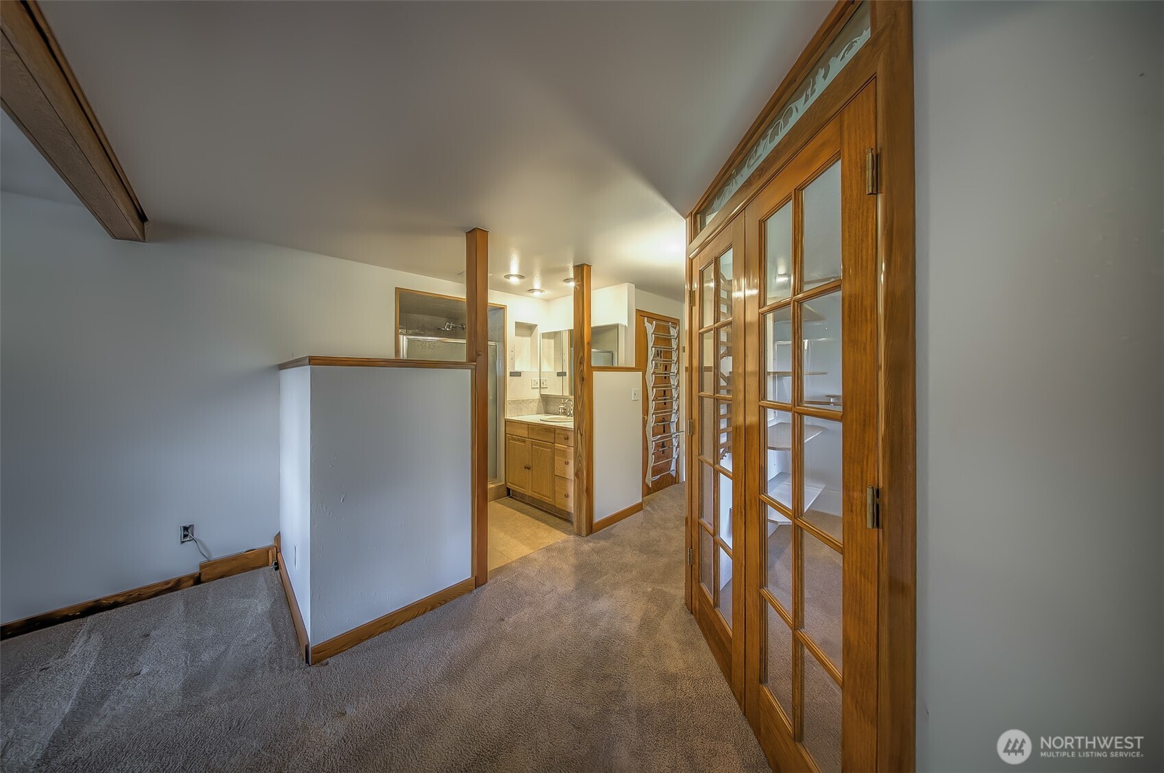 4110 Baker Ames Road Northeast Olympia, WA 98506 - Photo 27 of 40 a view of a hallway with a kitchen
