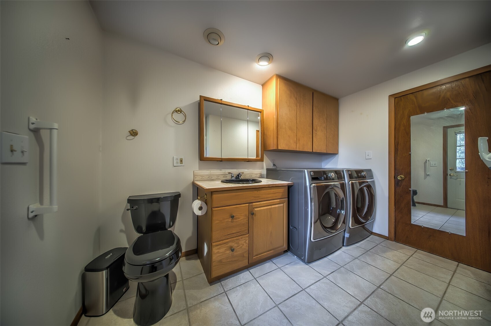 4110 Baker Ames Road Northeast Olympia, WA 98506 - Photo 33 of 40 a utility room with sink dryer and washer