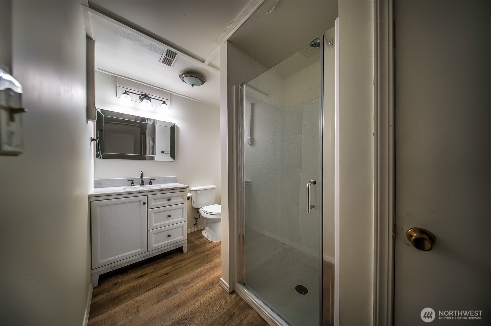 4110 Baker Ames Road Northeast Olympia, WA 98506 - Photo 38 of 40 a spacious bathroom with a granite countertop sink mirror and toilet
