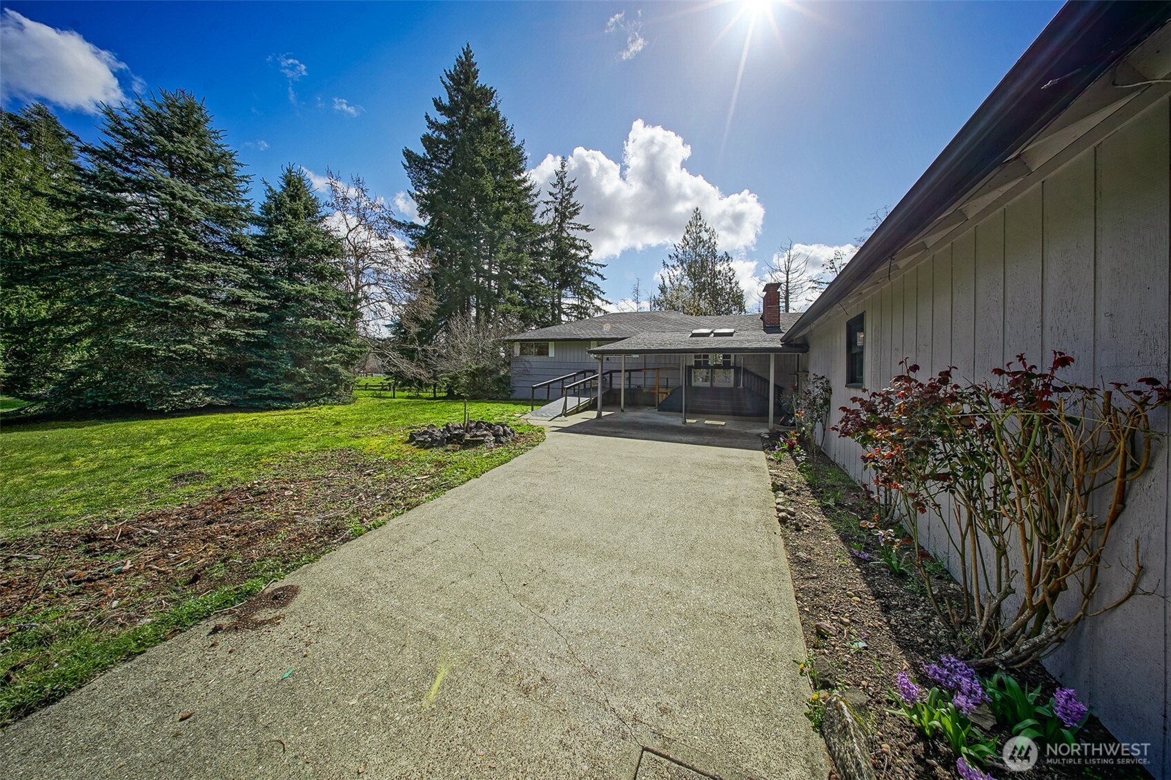 4110 Baker Ames Road Northeast Olympia, WA 98506 - Photo 4 of 40 a view of a porch with a table and a chairs