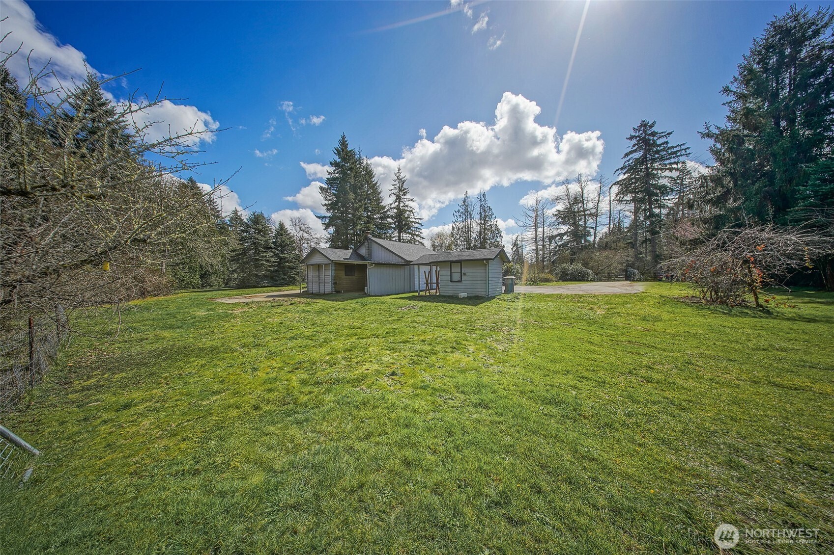 4110 Baker Ames Road Northeast Olympia, WA 98506 - Photo 8 of 40 a view of a fountain in a yard with large trees