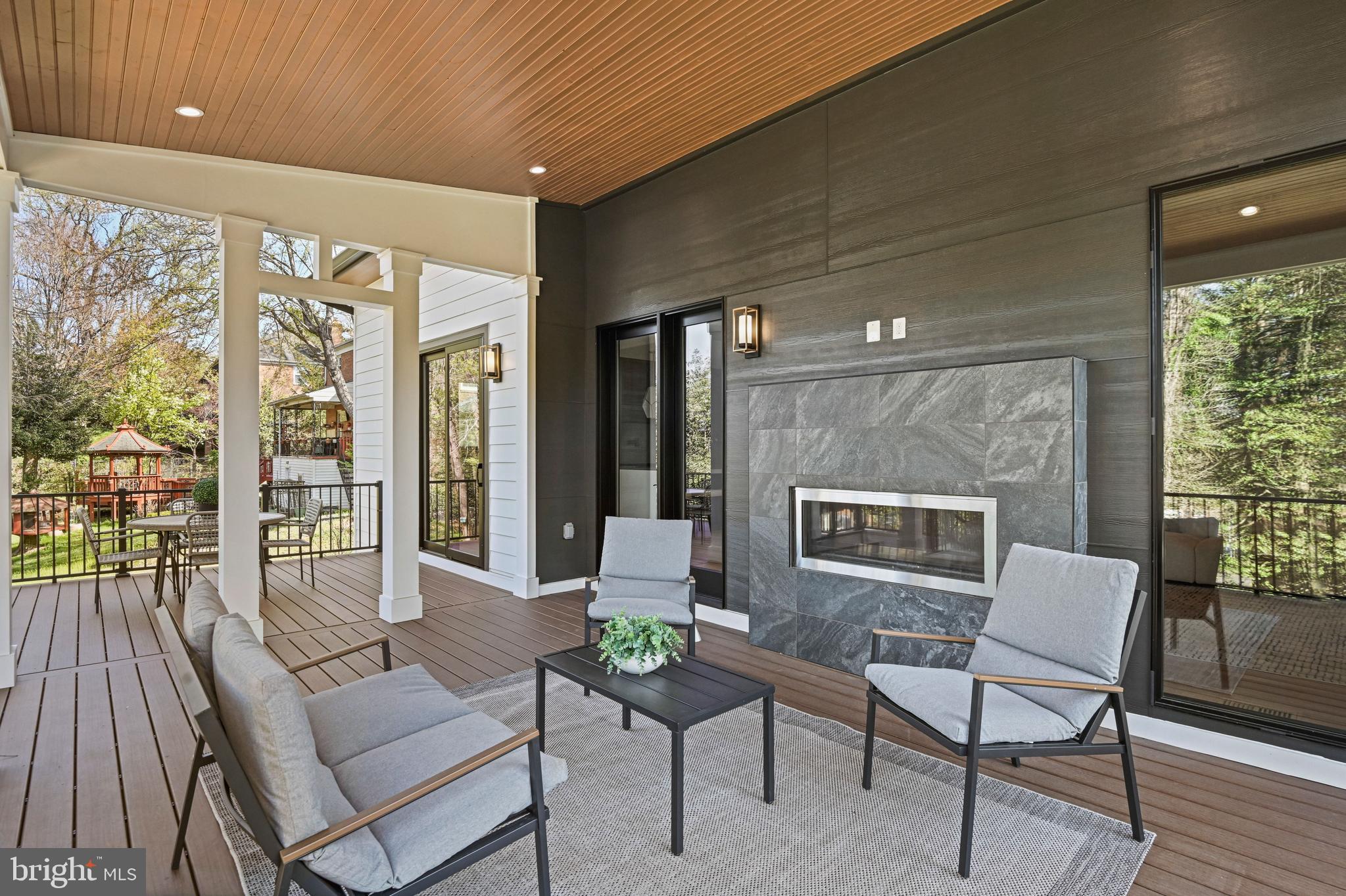 1052 Balls Hill Road McLean, VA 22101 - Photo 55 of 64 Covered porch with gas fireplace