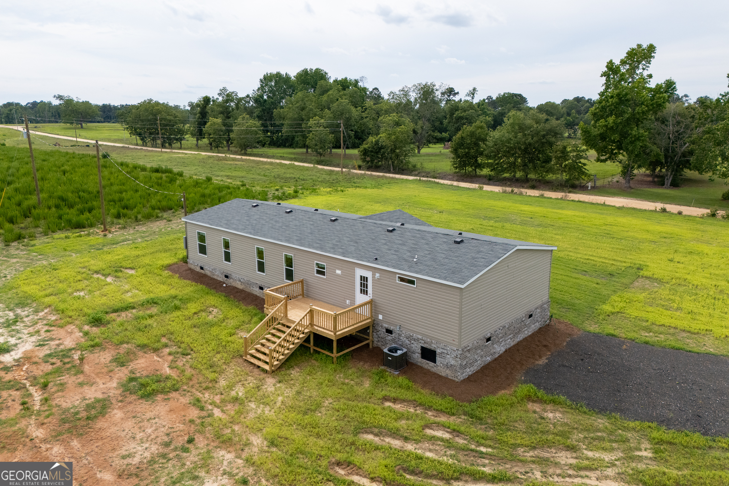 244 Ivey Hall Clark Road Garfield, GA 30425 - Photo 4 of 34 a aerial view of a house with big yard