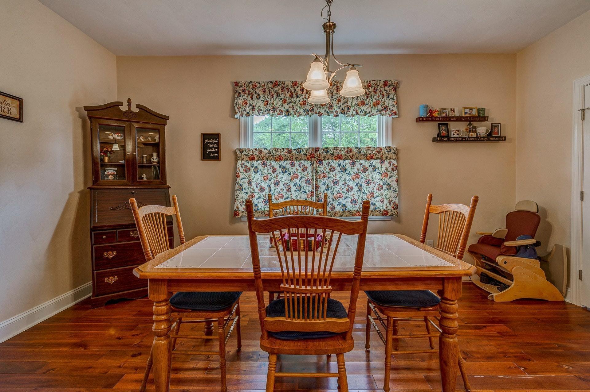 323 Turner Road Salem, VA 24153 - Photo 13 of 37 a view of a dining room with furniture and chandelier