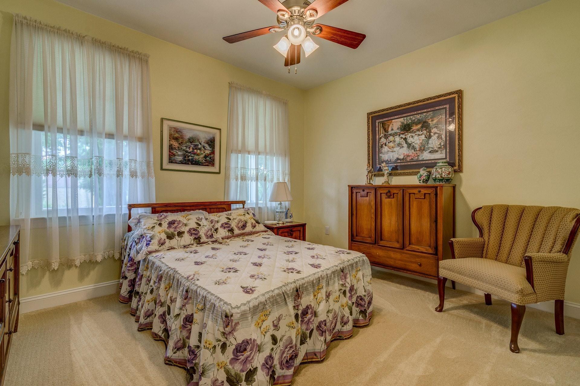 323 Turner Road Salem, VA 24153 - Photo 16 of 37 a bedroom with a bed and a chandelier