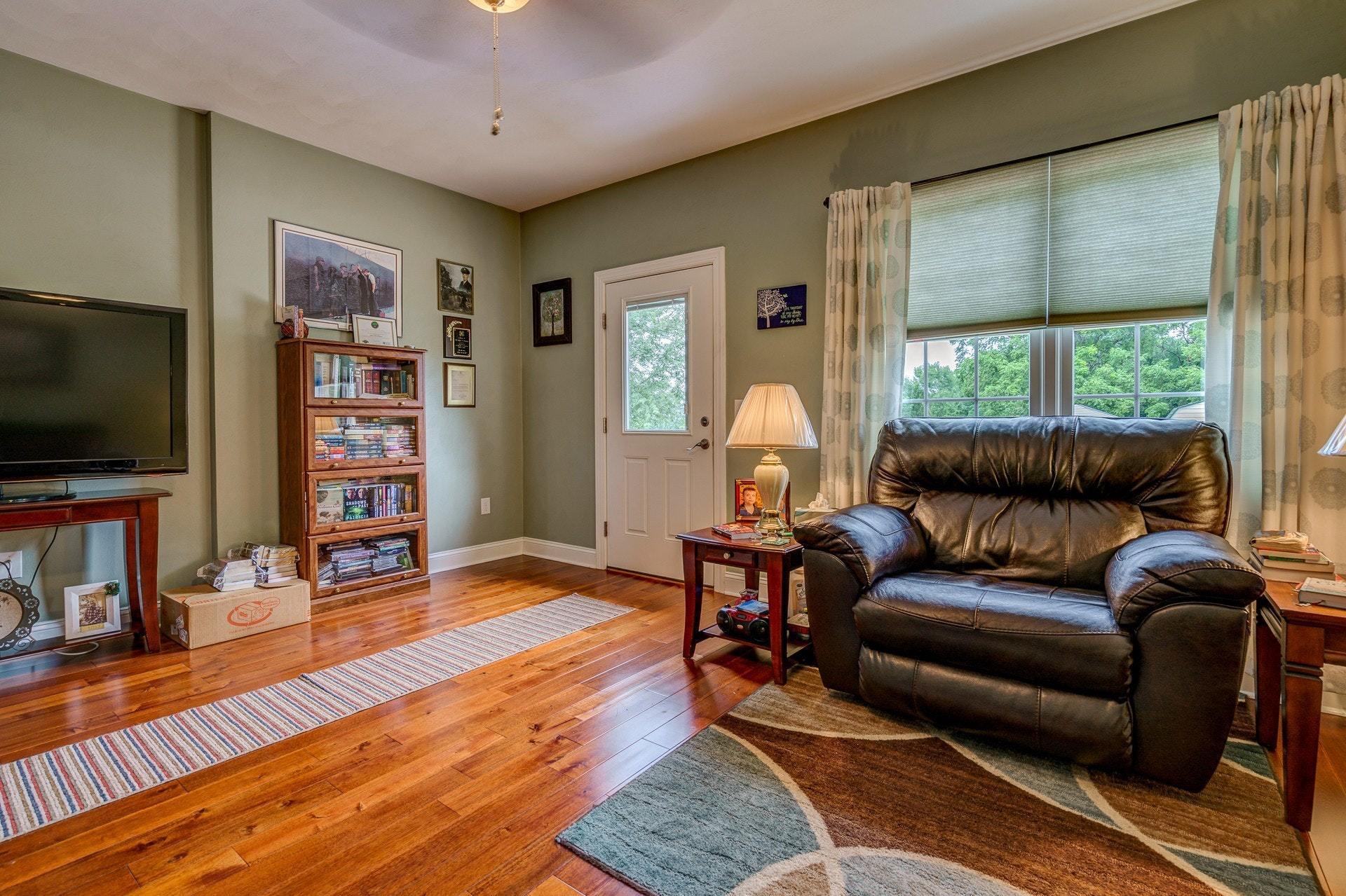 323 Turner Road Salem, VA 24153 - Photo 24 of 37 a living room with furniture and a flat screen tv
