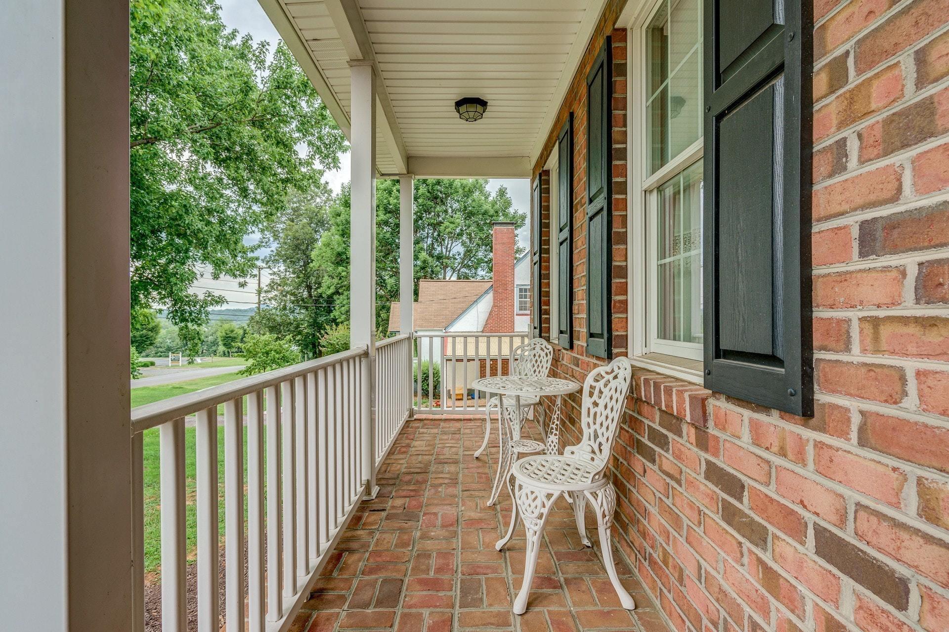 323 Turner Road Salem, VA 24153 - Photo 4 of 37 a view of a chairs and table in the balcony