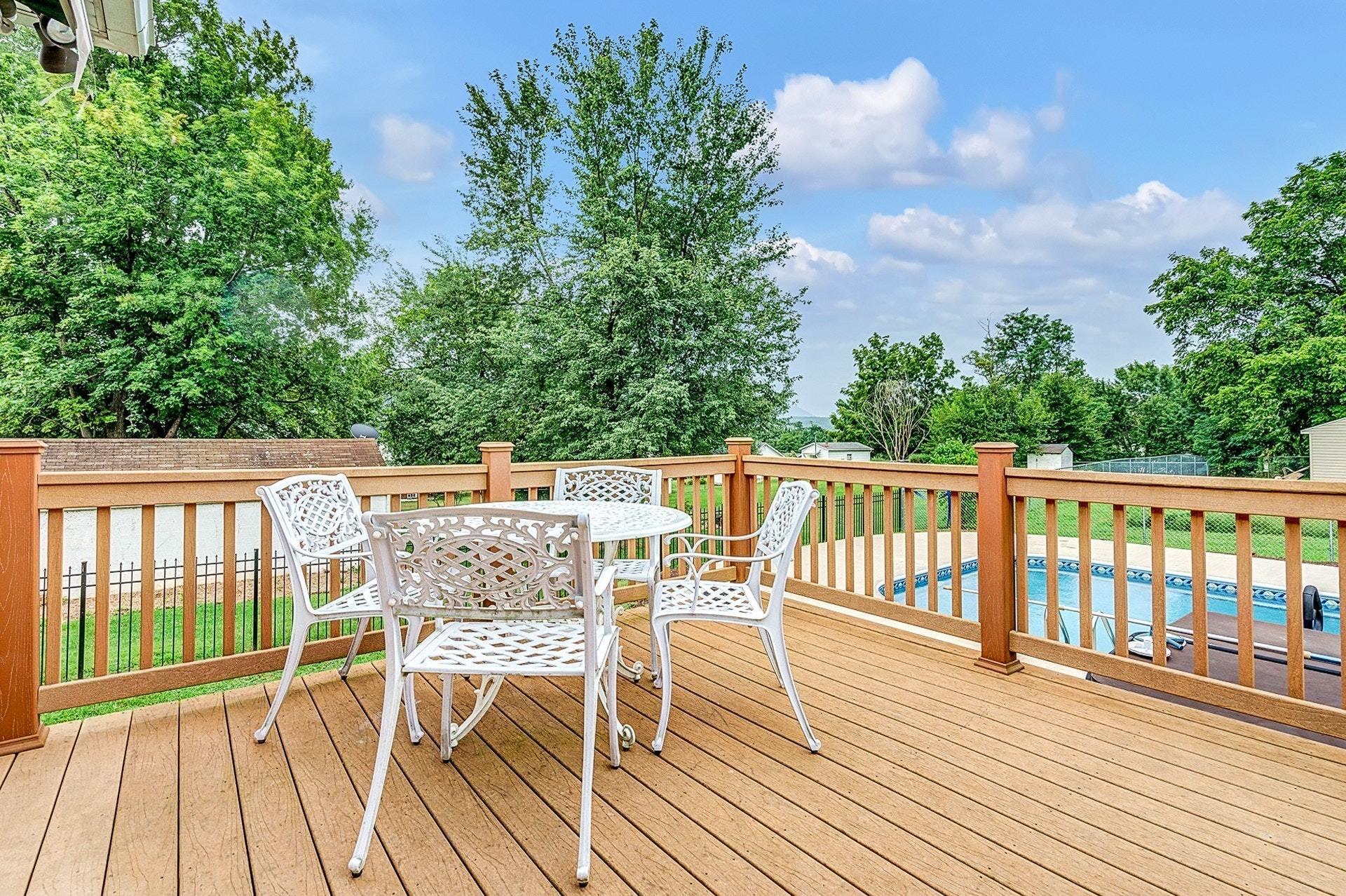 323 Turner Road Salem, VA 24153 - Photo 33 of 37 a balcony with wooden floor table and chairs