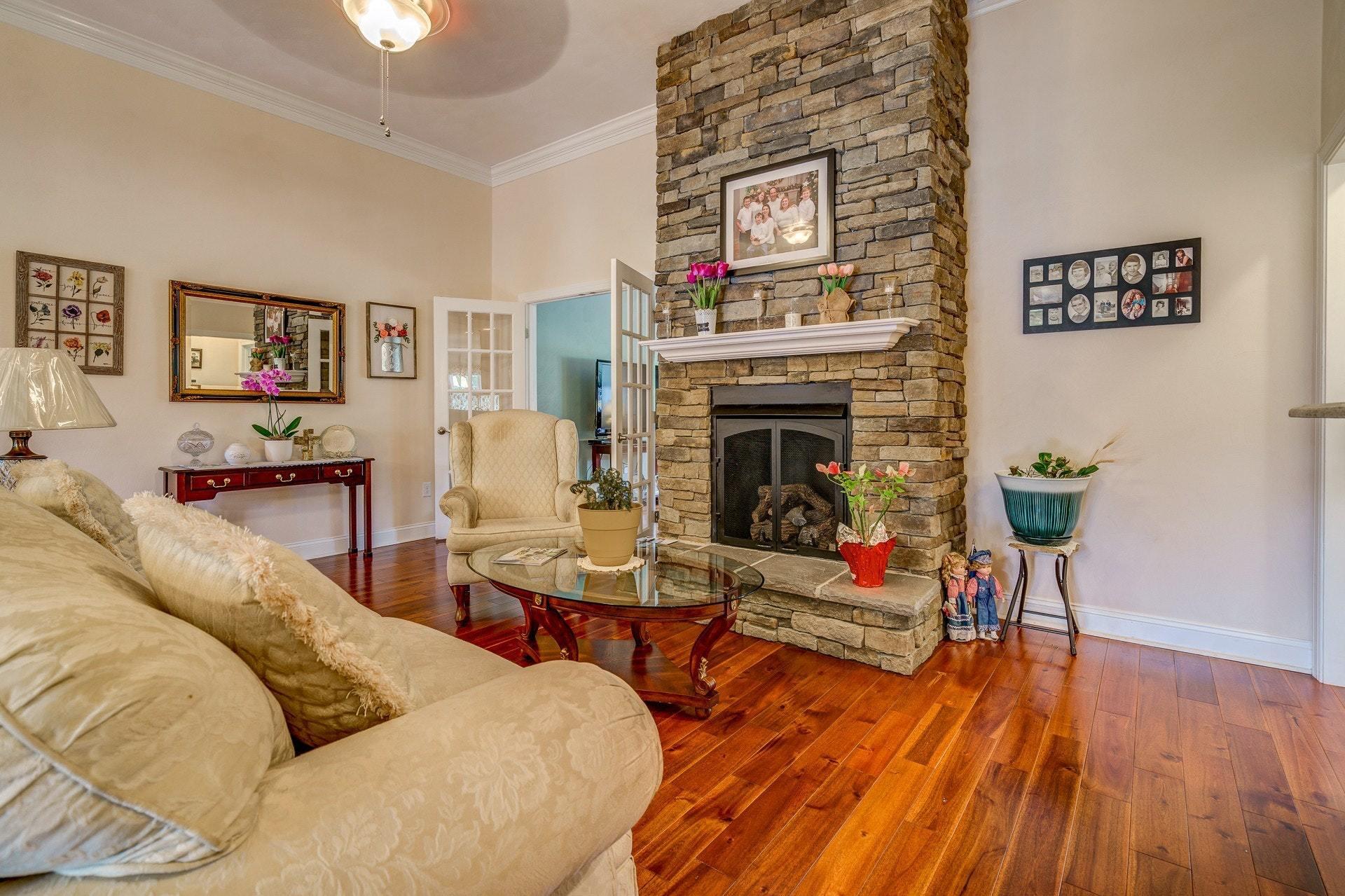 323 Turner Road Salem, VA 24153 - Photo 9 of 37 a living room with furniture and a fireplace
