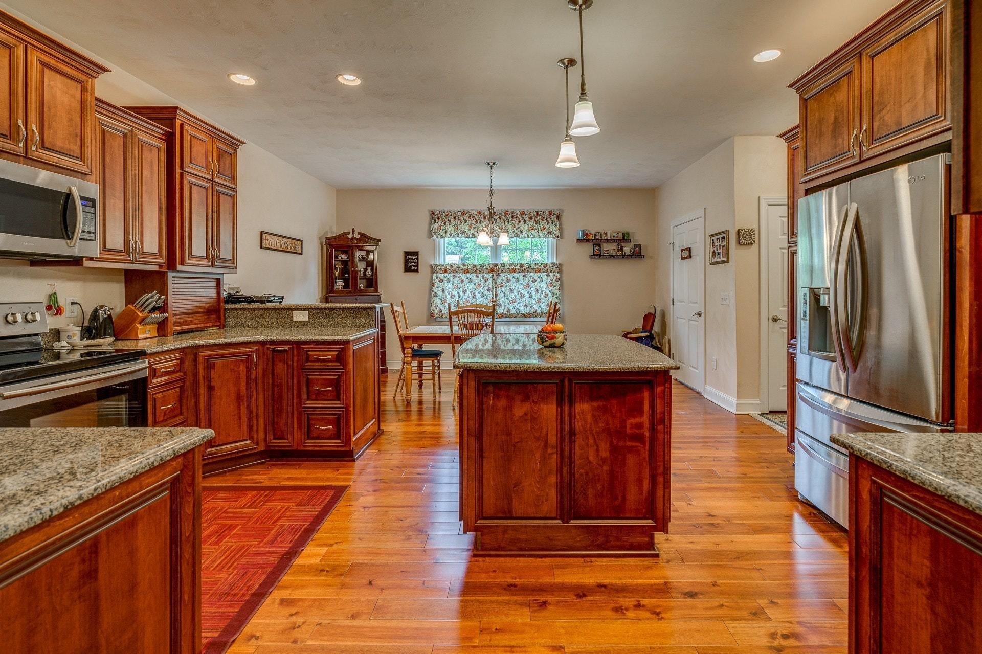 323 Turner Road Salem, VA 24153 - Photo 10 of 37 a kitchen with stainless steel appliances granite countertop wooden cabinets a refrigerator and a sink