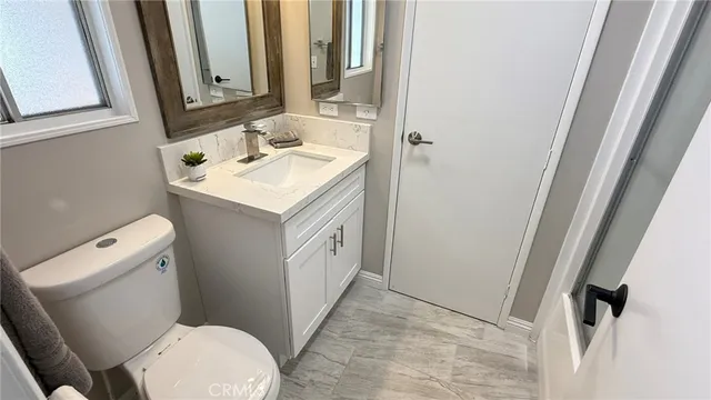 a bathroom with a sink and a toilet