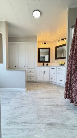 a view of kitchen with wooden floor and electronic appliances