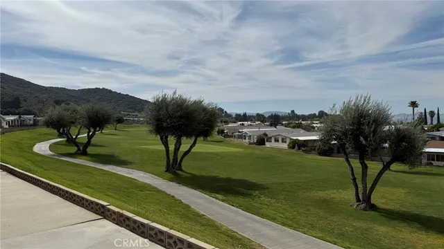 a view of a garden with a house