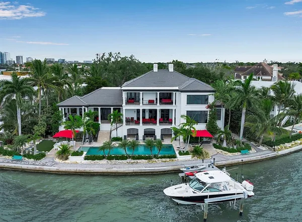 a view of a table and chairs under an umbrella