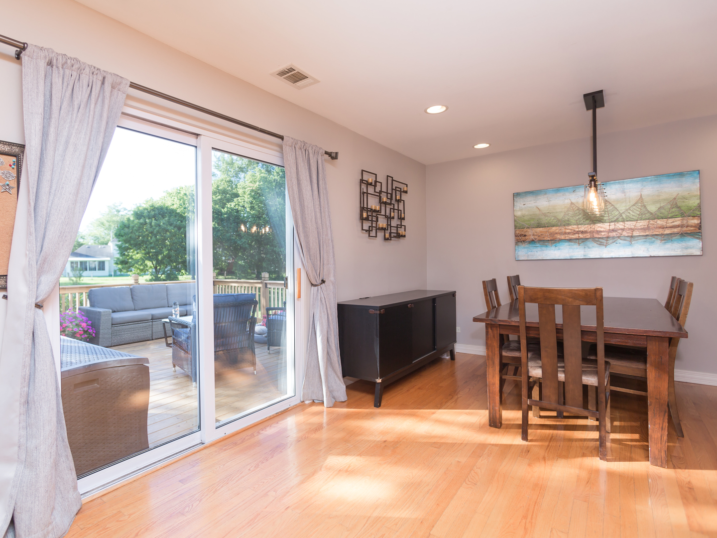 398 Rodenburg Road Roselle, IL 60172 - Photo 17 of 43 a dining room with furniture a chandelier and wooden floor