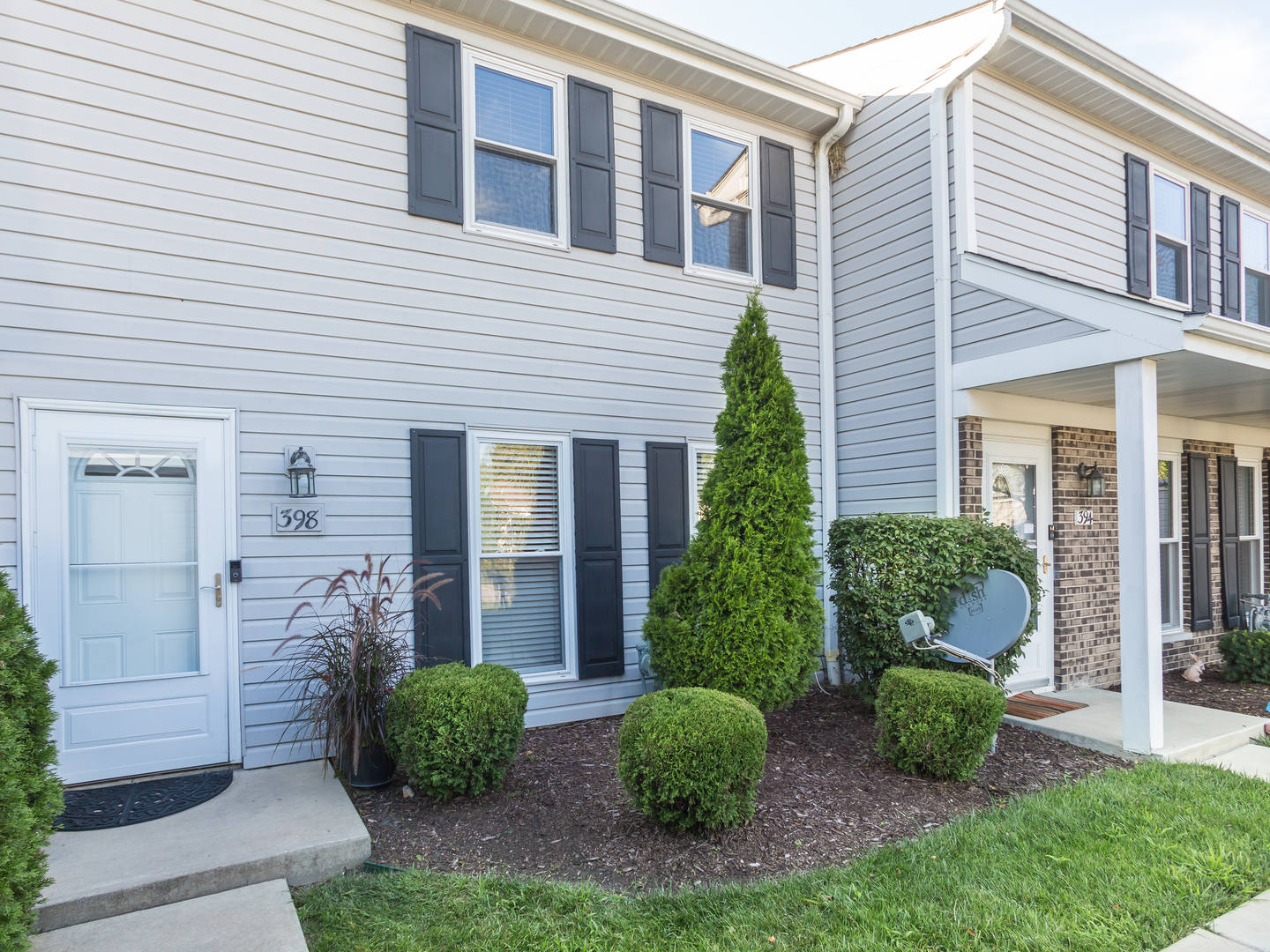 398 Rodenburg Road Roselle, IL 60172 - Photo 2 of 43 a front view of a house with garden