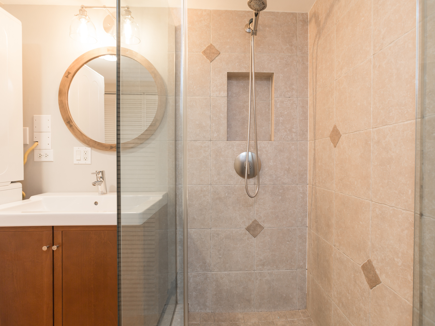 398 Rodenburg Road Roselle, IL 60172 - Photo 22 of 43 a bathroom with a sink a mirror a vanity and a shower
