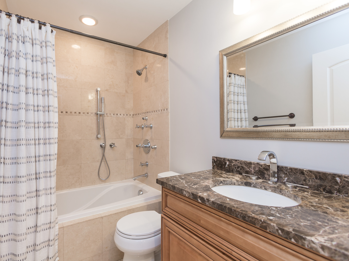 398 Rodenburg Road Roselle, IL 60172 - Photo 29 of 43 a bathroom with a granite countertop sink toilet mirror and shower