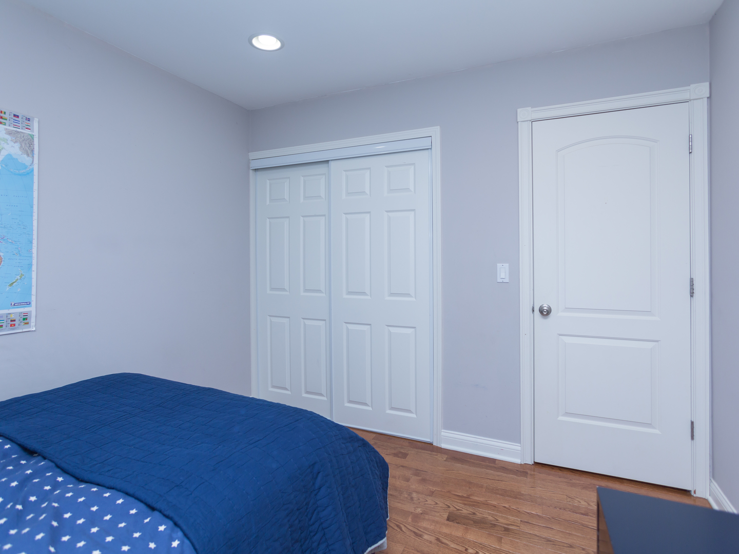 398 Rodenburg Road Roselle, IL 60172 - Photo 34 of 43 a bedroom with a bed and wooden floor
