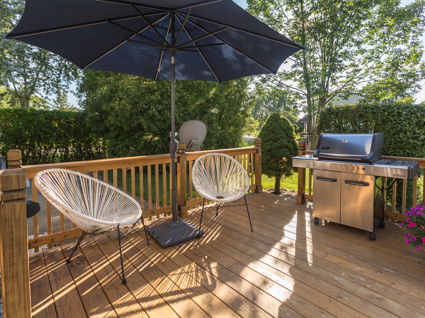 398 Rodenburg Road Roselle, IL 60172 - Photo 38 of 43 a view of a patio with a table and chairs under an umbrella