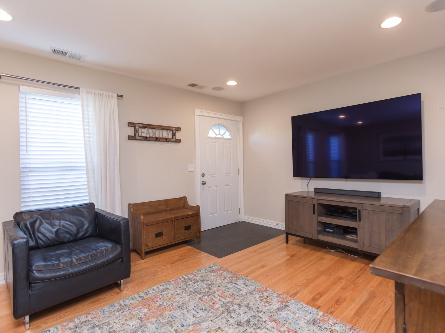 398 Rodenburg Road Roselle, IL 60172 - Photo 8 of 43 a living room with furniture and a flat screen tv