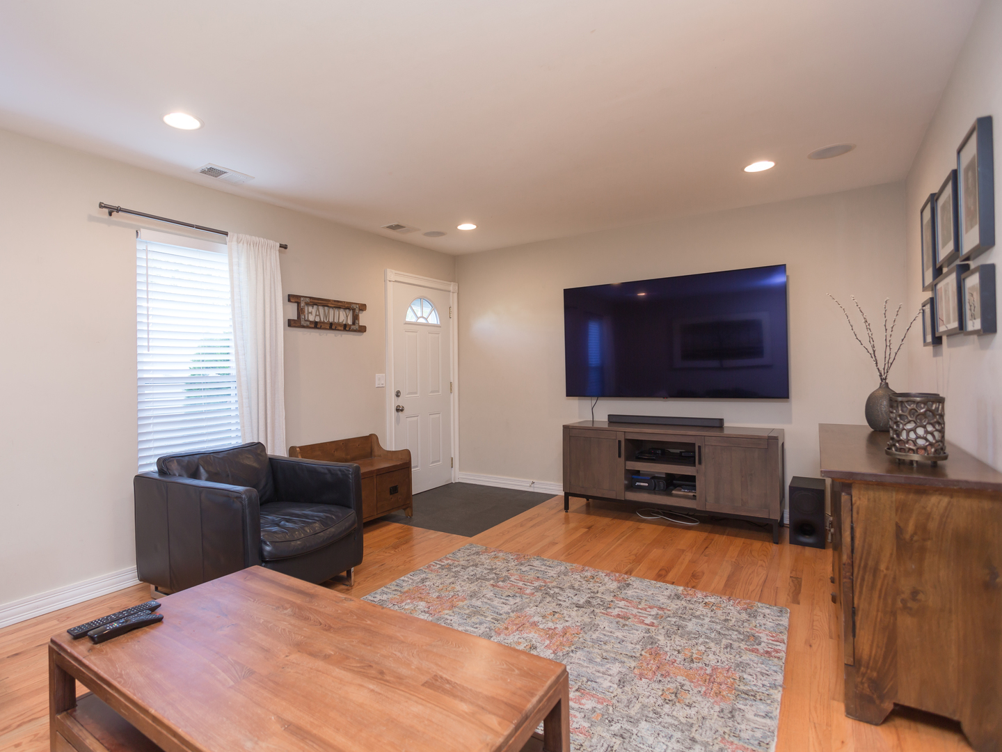 398 Rodenburg Road Roselle, IL 60172 - Photo 9 of 43 a living room with furniture and a flat screen tv
