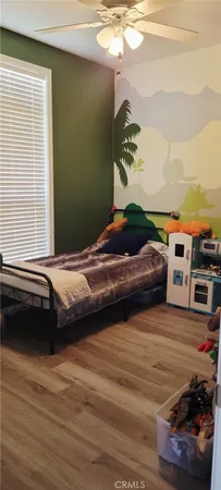 a bedroom with a bed and a book shelf