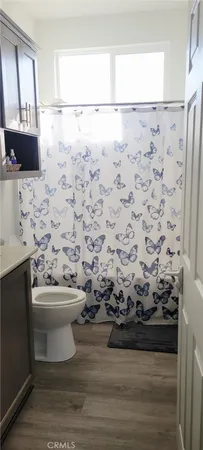 a bathroom with a sink toilet and mirror