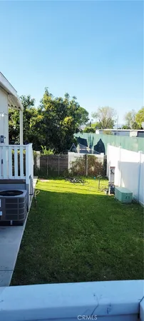 a view of a swimming pool with a garden and seating area