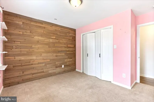 a bathroom with a granite countertop sink a large mirror and a bathtub