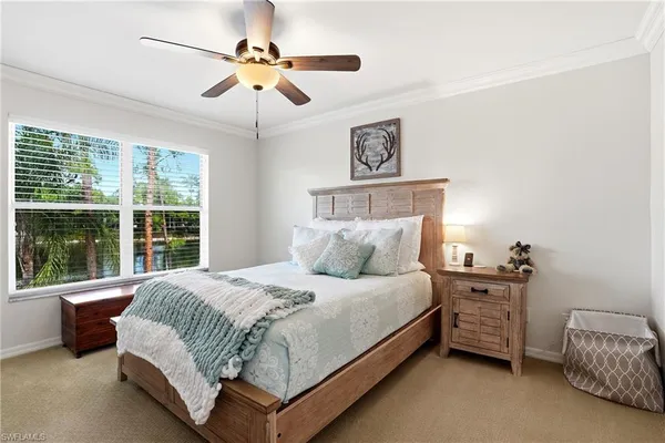 a bedroom with a bed dresser and a window
