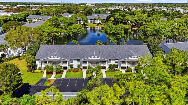 an aerial view of multiple houses with yard