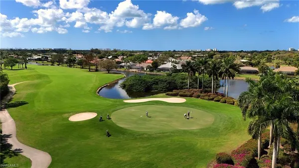 a view of a golf course with a swimming pool