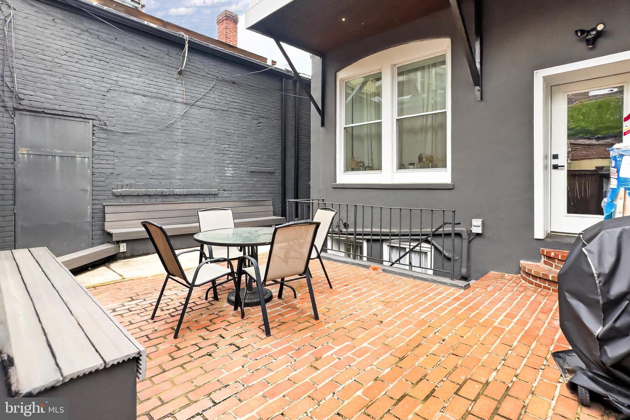 738 11th Street Northeast, Unit 3 Washington, DC 20002 - Photo 26 of 29 Charming patio with brick details.