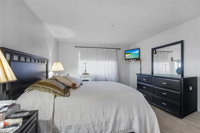 a bedroom with a bed and a dresser