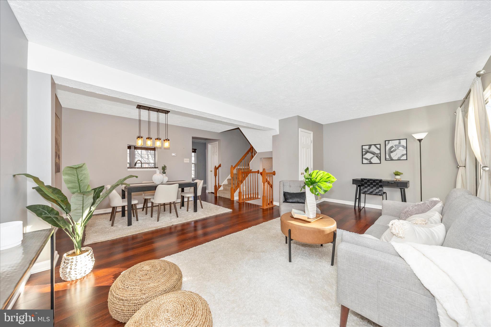 1511 Beverly Court Frederick, MD 21701 - Photo 12 of 72 a living room with furniture a wooden floor and a potted plant