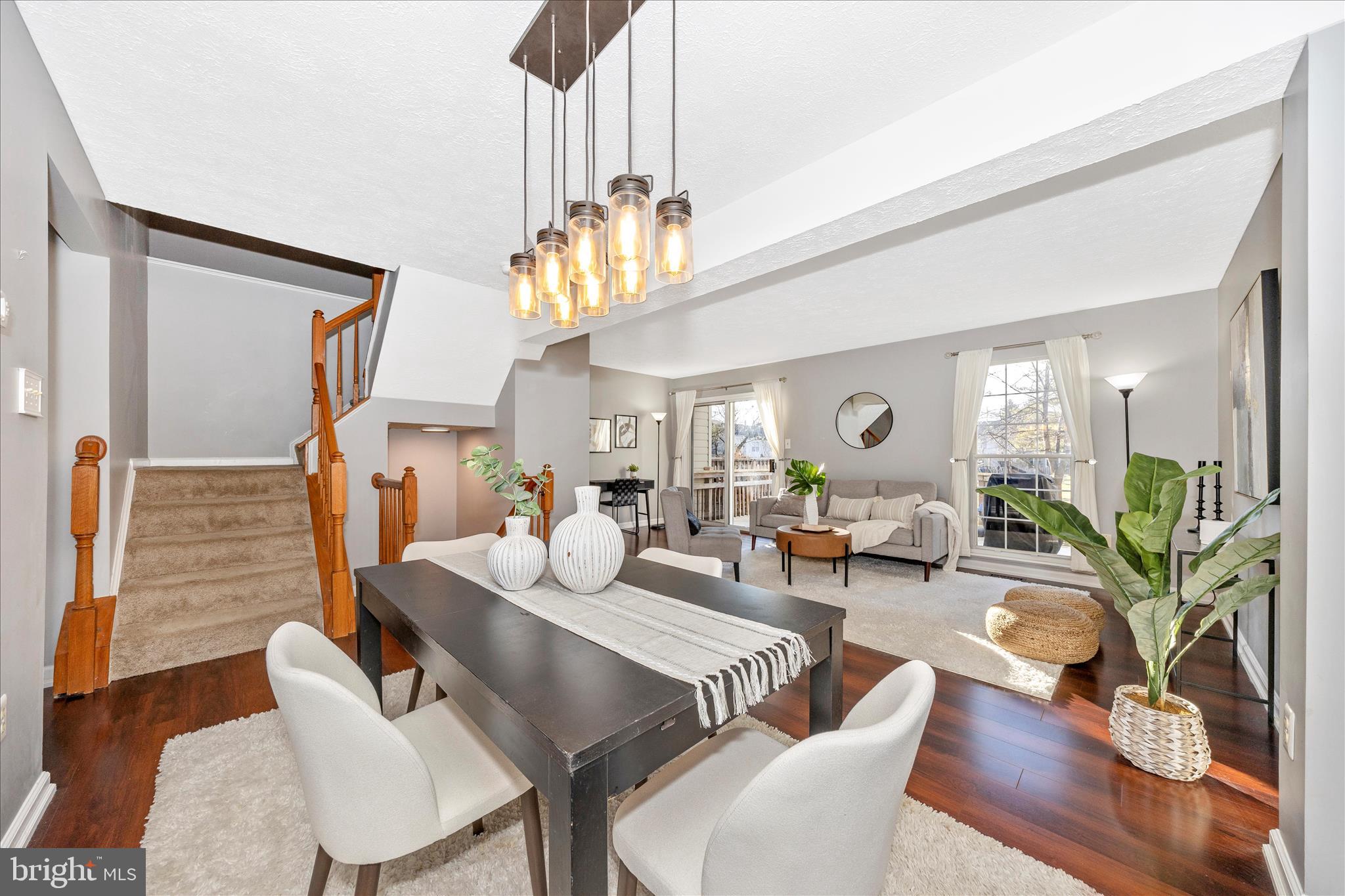 1511 Beverly Court Frederick, MD 21701 - Photo 16 of 72 a living room with furniture a chandelier and wooden floor