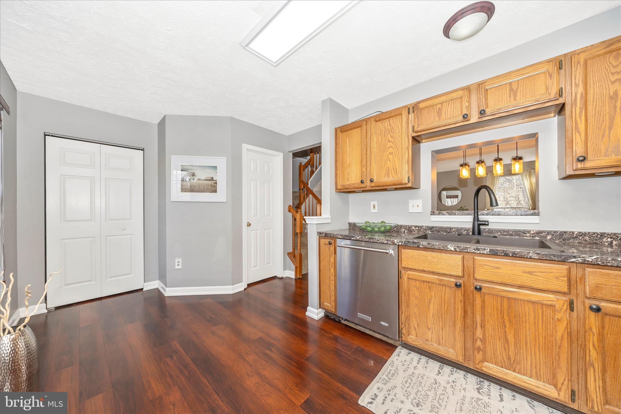 1511 Beverly Court Frederick, MD 21701 - Photo 18 of 72 a kitchen with granite countertop a sink cabinets and wooden floor