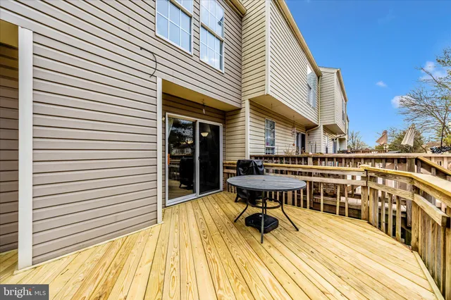 a view of a house with a patio and a yard